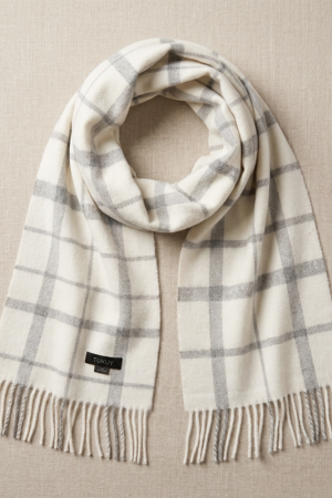 Luxury white and gray check alpaca scarf with fringed edges, highlighting its classic heritage pattern and soft natural alpaca wool.