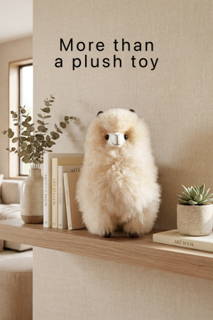 an alpaca plush that is also a decorative statement for a home with the text "more than a plush toy"