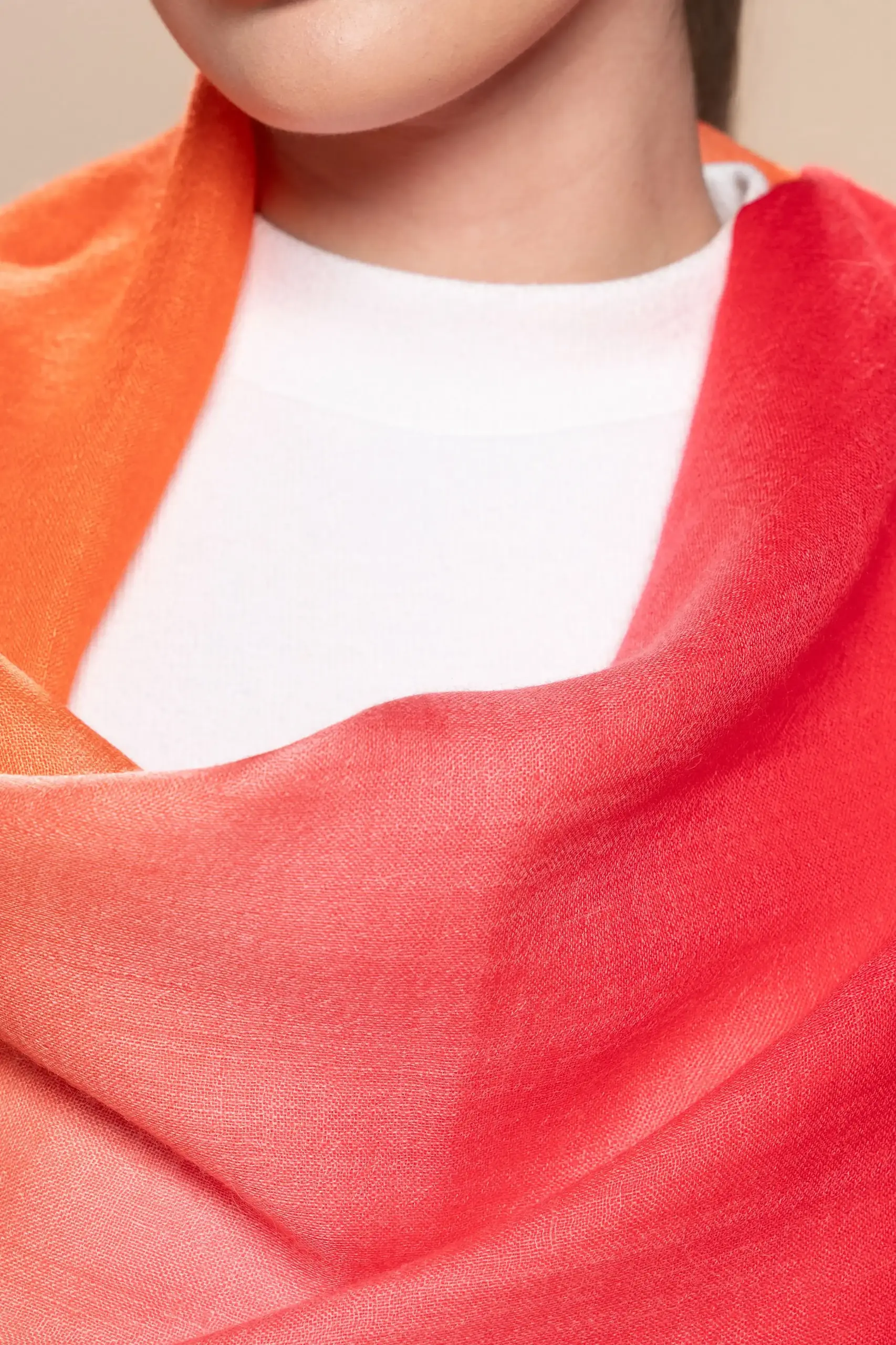 Close look at a red and orange alpaca shawl