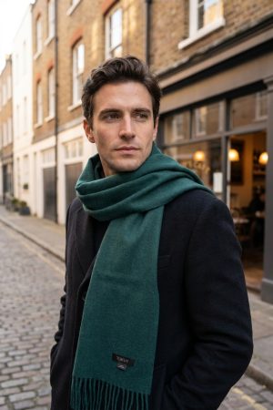 male model using a green alpaca wool scarf in london
