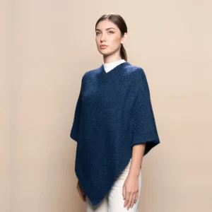 woman wearing a blue poncho made from 100% baby alpaca wool