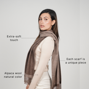 Woman wearing a reversible brown alpaca scarf made from natural alpaca wool, featuring ultra-soft texture, rich earthy tones, and a timeless design for effortless everyday styling.