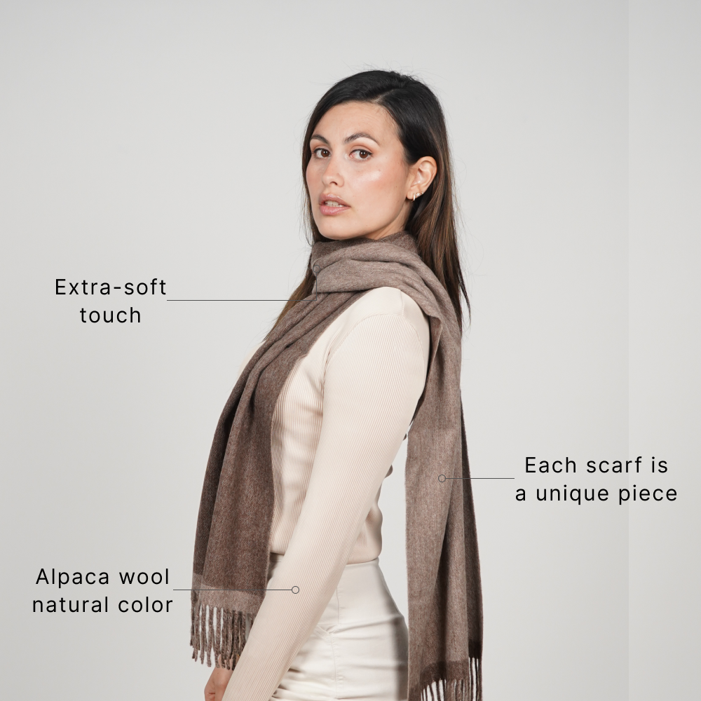 Woman wearing a reversible brown alpaca scarf made from natural alpaca wool, featuring ultra-soft texture, rich earthy tones, and a timeless design for effortless everyday styling.