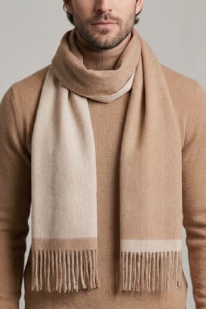 man wearing a reversible camel and beige alpaca scarf made from natural alpaca wool, featuring ultra-soft texture, warm natural tones, and a timeless design that complements neutral outfits.