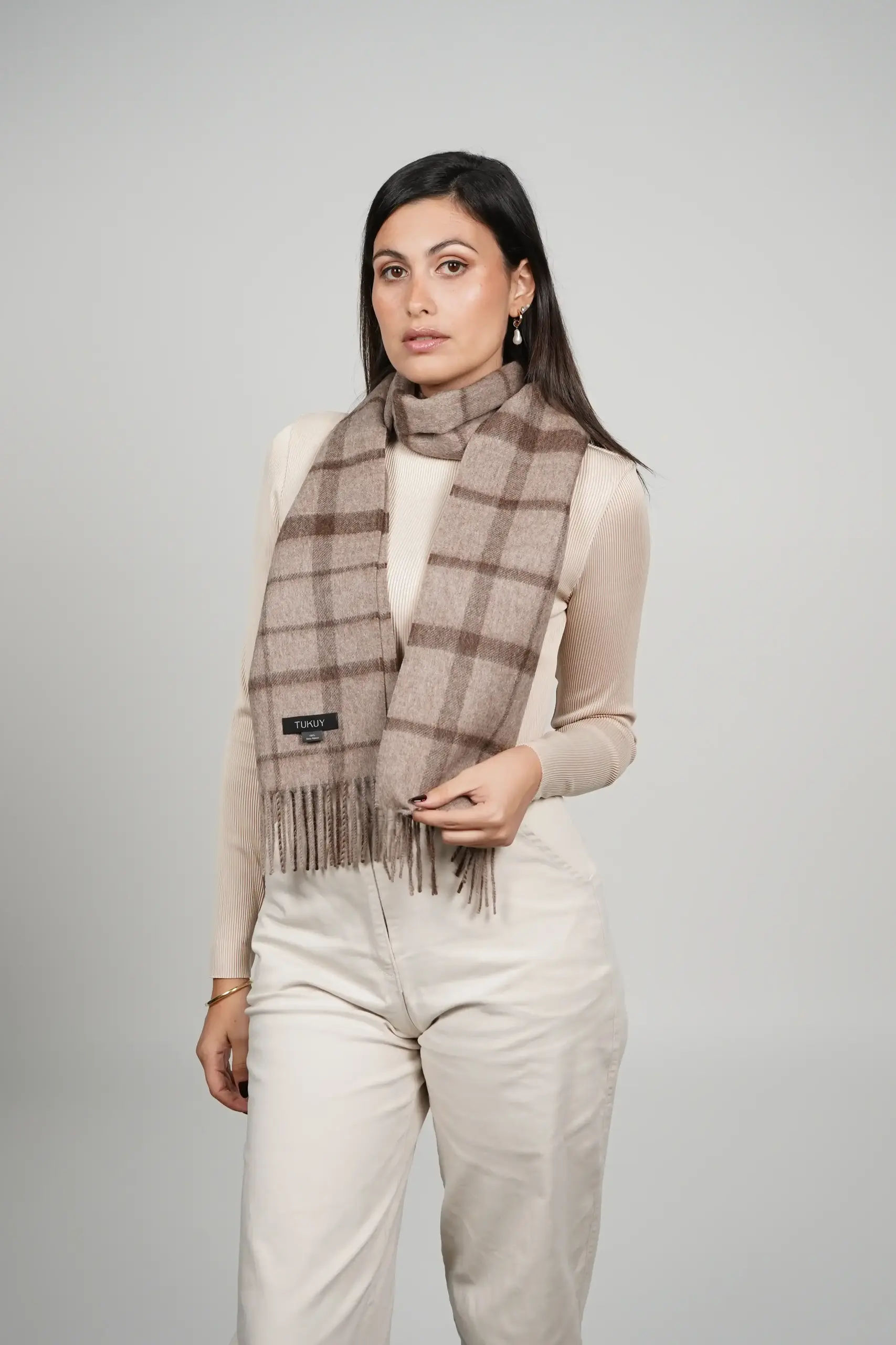 women wearing a luxurious check scarf in brown, alpaca scarf made with 100% baby alpaca wool by Tukuy Brand