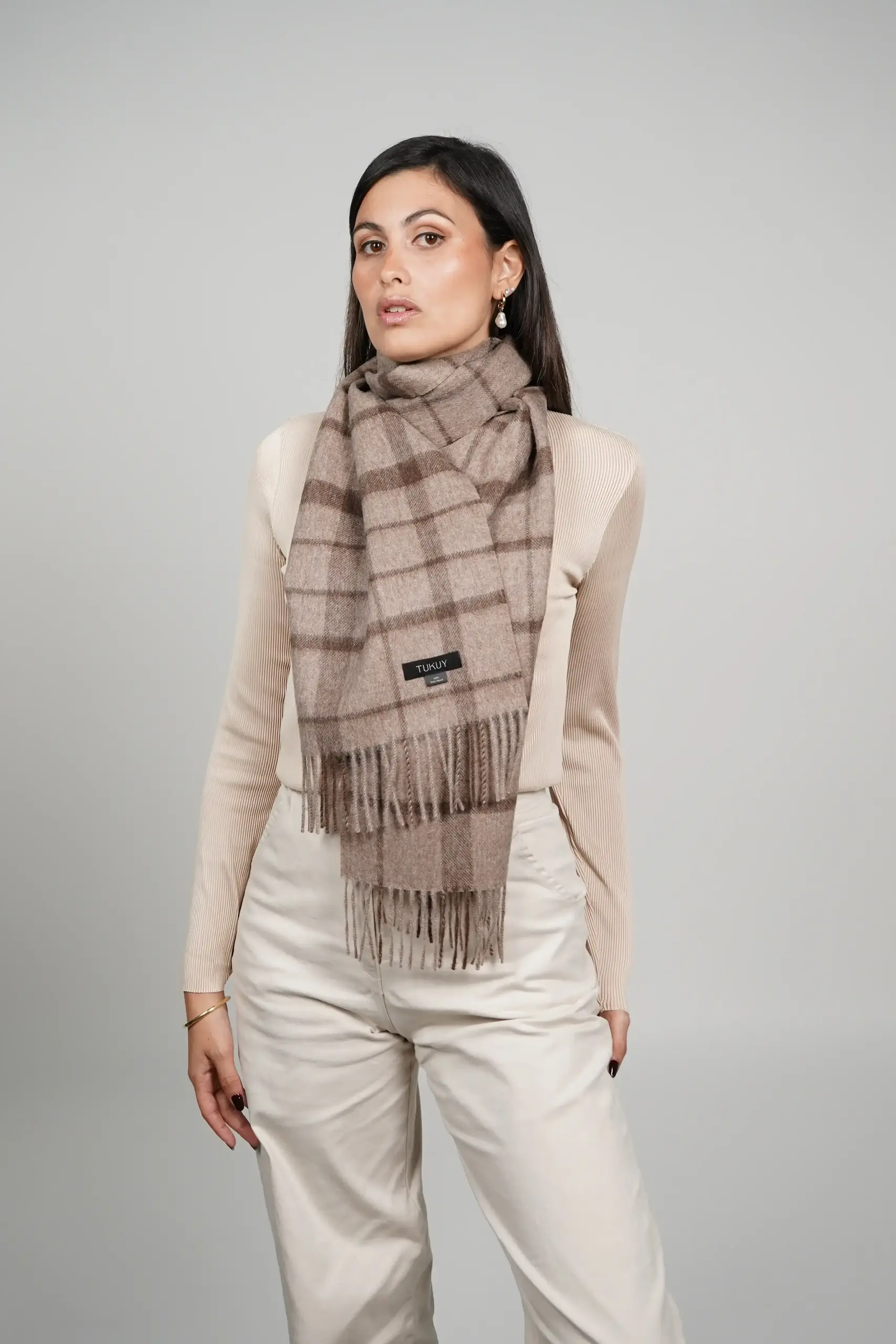 women wearing a luxurious check scarf in chocolate brown, alpaca scarf made with 100% baby alpaca wool by Tukuy Brand