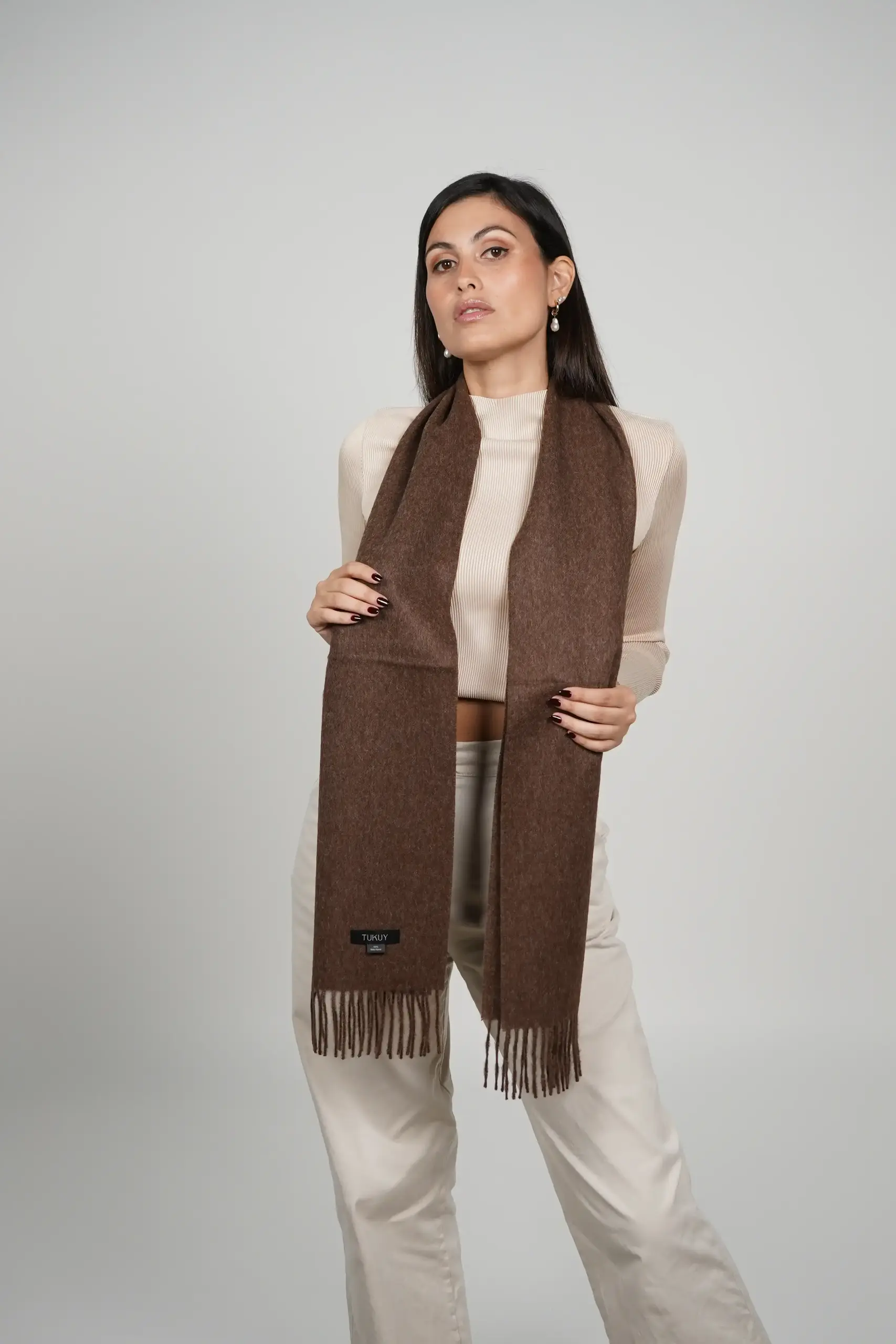 women wearing an alpaca scarf in chocolate brown luxurious touch alpaca gift for christmas by Tukuy Brand