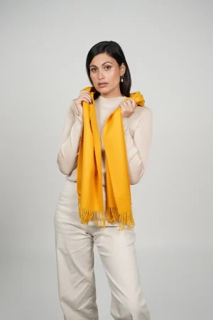 alpaca scarf in yellow. intense yellow color scarf by tukuy brand. women wearing an alpaca scarf in yellow.