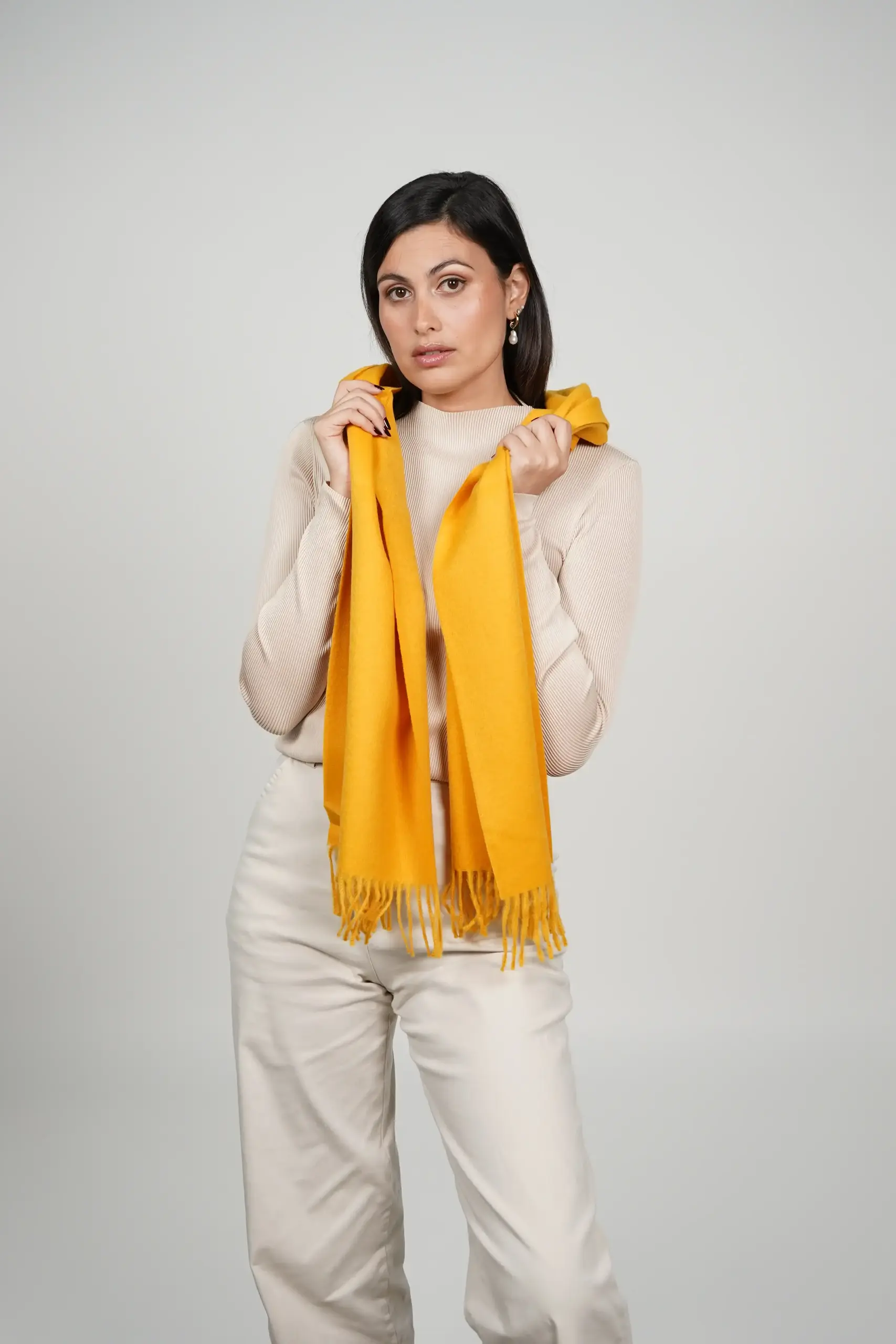 alpaca scarf in yellow. intense yellow color scarf by tukuy brand. women wearing an alpaca scarf in yellow.