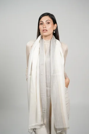 women wearing a white alpaca shawl with silk. Alpaca and silk shawl made by Tukuy Brand