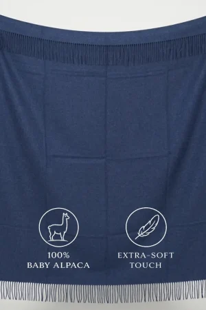 Baby alpaca blanket in deep blue displaying its full design and extra-soft texture