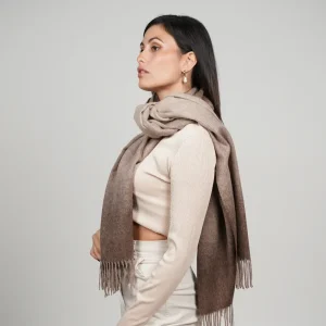 Baby alpaca shawl in brown ombre wrapped around the neck showcasing its elegant texture
