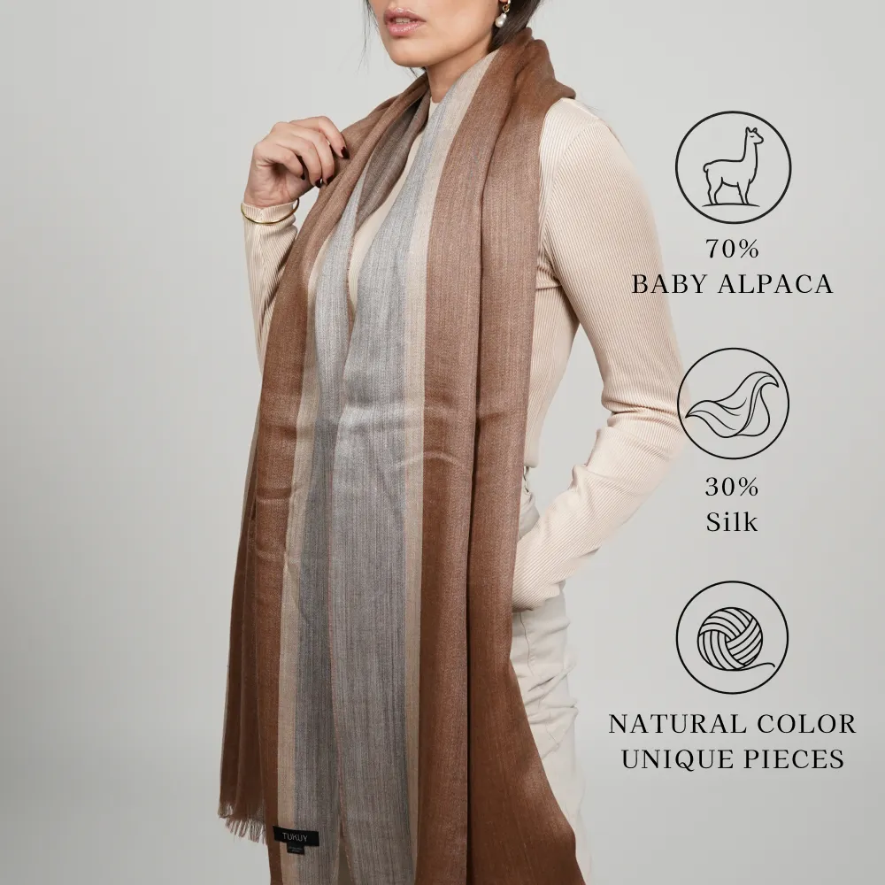 Model wearing a brown-color alpaca shawl made of 70% baby alpaca and 30% silk; natural color, unique pieces