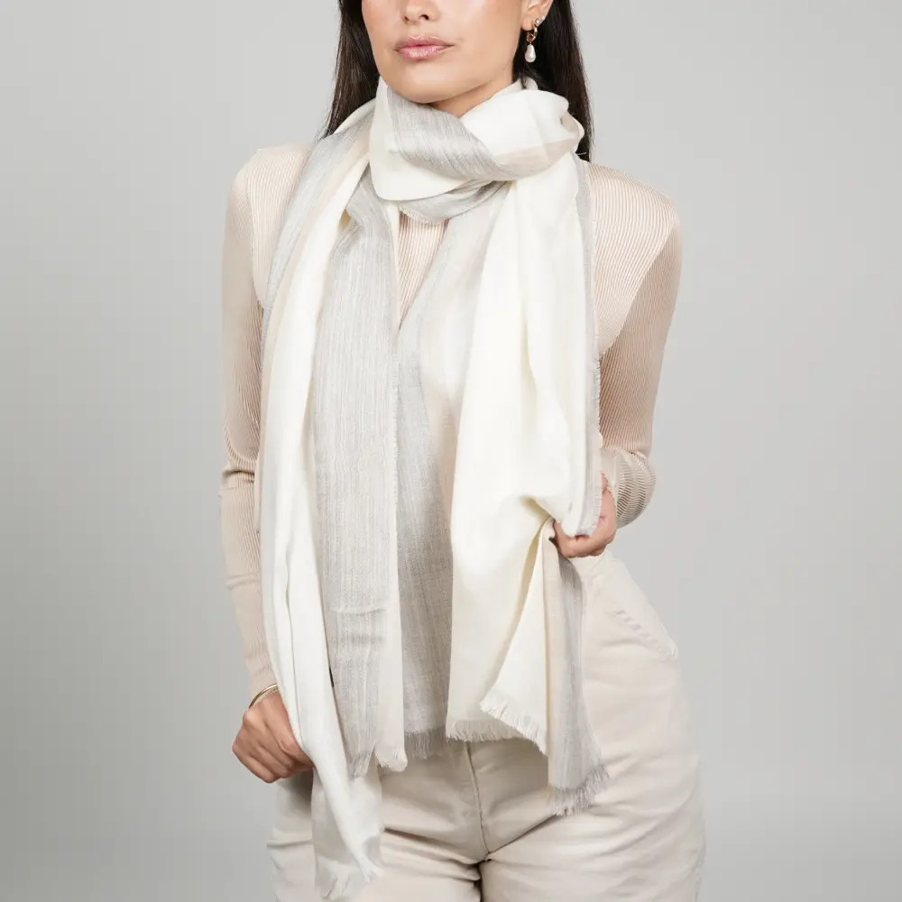 Baby alpaca and silk shawl in grey and white wrapped around the neck